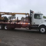 2009 Volvo with 1010 BuiltRite Handler Grapple.